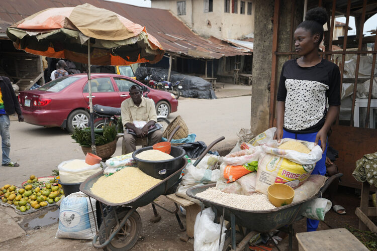 A woman sells food items at a market in Owo, Southwestern Nigeria, Tuesday, June 7, 2022. Nigeria's consumer inflation surged to a 17-year high in August 2022, its statistics agency said on Thursday, Sept. 15, 2022, signalling more hardship for citizens and businesses in Africa's largest economy. (AP Photo/Sunday Alamba)