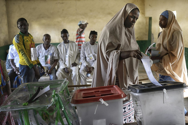 A woman votes at a polling station in Kano, Nigeria, March 28, 2015. Many Nigerians fear a clash along religious, ethnic, and sectional lines regardless of the result of the presidential race between incumbent Goodluck Jonathan, a Christian from the south, and Muhammadu Buhari, a former military ruler and Muslim northerner. (Samuel Aranda/The New York Times)