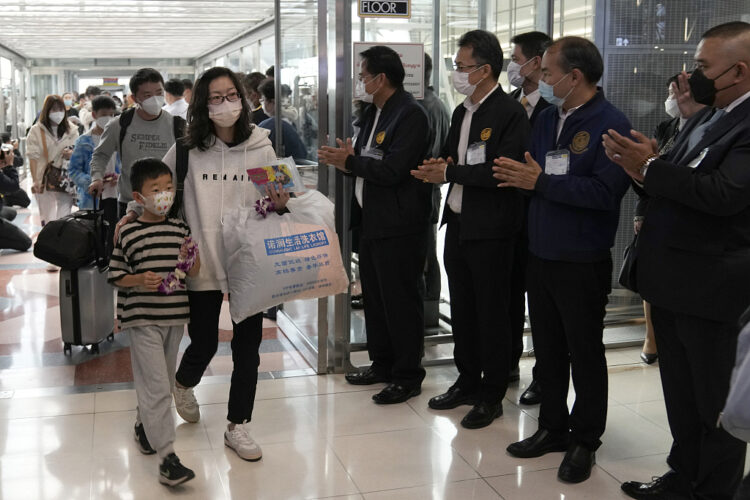 Duniya Chinese tourists arrive at Suvarnabhumi International Airport in Samut Prakarn province, Thailand, Monday, Jan. 9, 2023. Thailand is looking forward to hosting large numbers of vistors from China again after Beijing eased travel restrictions on Sunday. Chinese were about one-third of the total number of tourists visiting Thailand before the coronavirus pandemic, and the authorities hope they can help its lucrative tourism industry recover.(AP Photo/Sakchai Lalit)