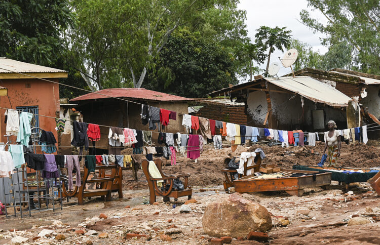 Clothes are hung out to dry on called electrical power lines caused by last week's heavy rains caused by Tropical Cyclone Freddy in Phalombe, southern Malawi Saturday, March 18, 2023. Authorities are still getting to grips with destruction in Malawi and Mozambique with over 370 people confirmed dead and several hundreds still displaced or missing. (AP PhotoThoko Chikondi)