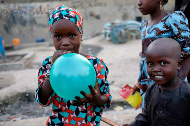 Five-year-old Fatima shows off her Sallah gift in a camp for those internally displaced by the ongoing violence in Maiduguri, the capital of Borno State in northeast Nigeria.