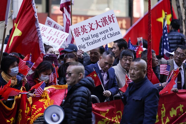 Taiwan Protesters opposed to Taiwanese independence gather at a hotel where Taiwanese President Tsai Ing-wen is expected to arrive in New York, Wednesday, March 29, 2023. (AP Photo/Seth Wenig)