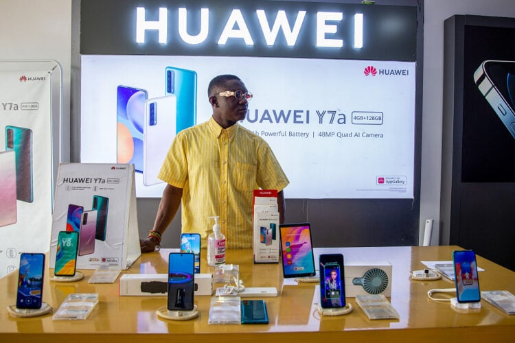 A sales assistant waits for customers at the Huawei Technologies Co. branded booth inside Awolowo glass house in Lagos, Nigeria, on Monday, March 29, 2021. Nigerians are having to contend with the highest inflation rate in four years, the second-highest unemployment rate on a list of 82 countries tracked by Bloomberg, and an economy that’s only just emerged from recession. Photographer: Adetona Omokanye/Bloomberg