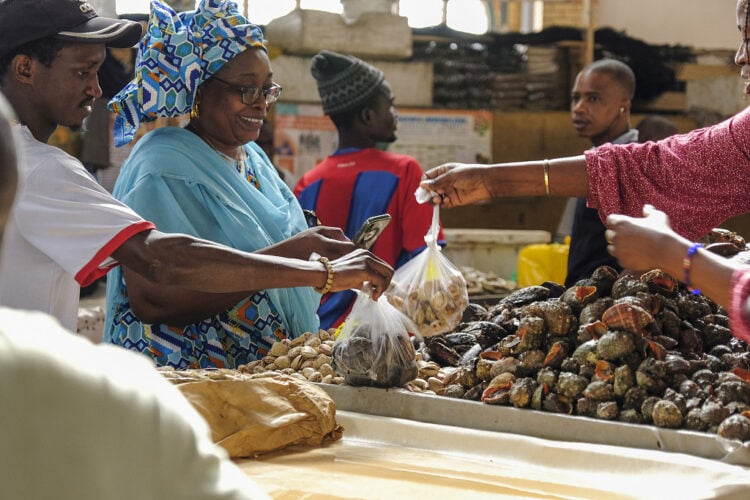 Customers shop for fresh shellfish inside Kermel market in central Dakar, Senegal, on Wednesday, Dec. 6, 2023. West Africa’s growth slowed to 3.7% this year from 3.9% in 2022 due to the global economy and higher inflation, the Economic Community of West African States said. Photographer: Damian Lemański/Bloomberg