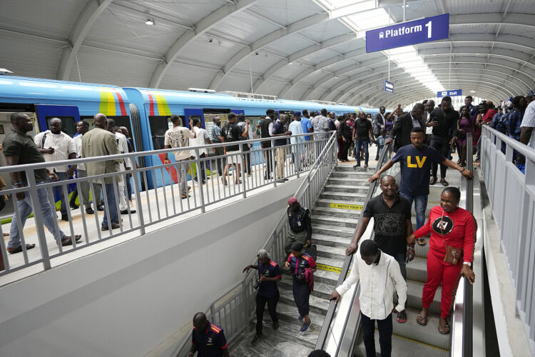 People exit from a new Lagos blue line train in Lagos, Nigeria, Monday, Sept. 4, 2023. Lagos state government on Monday, began its 13km (9 miles)metro blue line services to the public . Officials say The Blue Line Rail is one of the rail projects designed to make Lagos a fully interconnected city and it will transform the city's transport system. (AP Photo/Sunday Alamba)