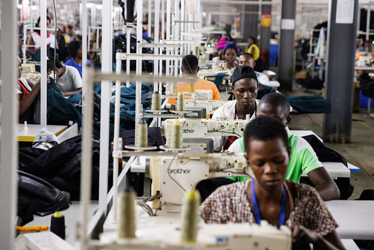 Si Workers sew denim jeans at machines in the Xinlon Textile and Garment Technology Co Ltd. factory at the Sino-Uganda Mbale Industrial Park in Mbale, Uganda, on Wednesday, Jan. 24, 2024. Under Chinese President Xi Jinping’s Belt and Road Initiative, China has extended about $900 billion over the past decade in infrastructure and other projects around the world, including in Africa. Photographer: Luke Dray/Bloomberg