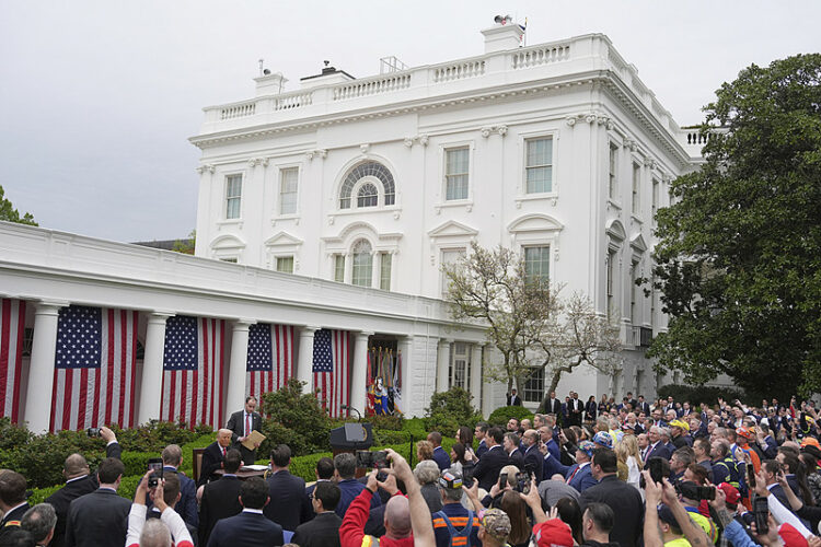 President Donald Trump signs an executive order during an event to announce new tariffs in the Rose Garden of the White House, Wednesday, April 2, 2025, in Washington. (AP Photo/Evan Vucci)