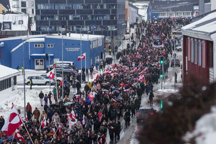 FILE - A crowd walks to the US consulate to protest against Trump's policy towards Greenland in Nuuk, Greenland, Saturday, Jan. 17, 2026. (AP Photo/Evgeniy Maloletka, File)