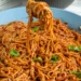 Yadda Ake Hada Dafadikan Taliya (Jollof Spaghetti)