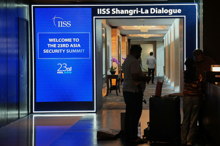 Sin A man stands near the entrance of the Shangri-La Hotel, the venue for the International Institute for Strategic Studies (IISS) Shangri-La Dialogue, Asia's annual defense and security forum, in Singapore, Thursday, May 28, 2026. (AP Photo/Achmad Ibrahim)