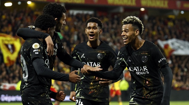 Paris Saint-Germain's French forward #49 Ibrahim Mbaye (L) is congratulated by teammates after scoring a goal during the French L1 football match between RC Lens and Paris Saint-Germain (PSG) at the Stade Bollaert-Delelis stadium in Lens on May 13, 2026. (Photo by SIMON WOHLFAHRT / AFP)