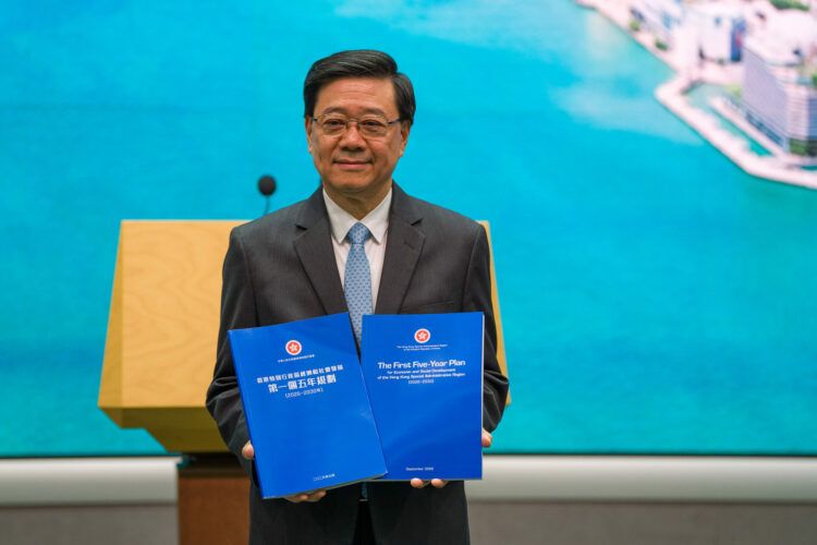 Hong Kong Chief Executive John Lee holds the Five Year Plan booklet at a press conference before his executive council meeting in Hong Kong, on September 15, 2026. (Photo by Vernon Yuen/NurPhoto)